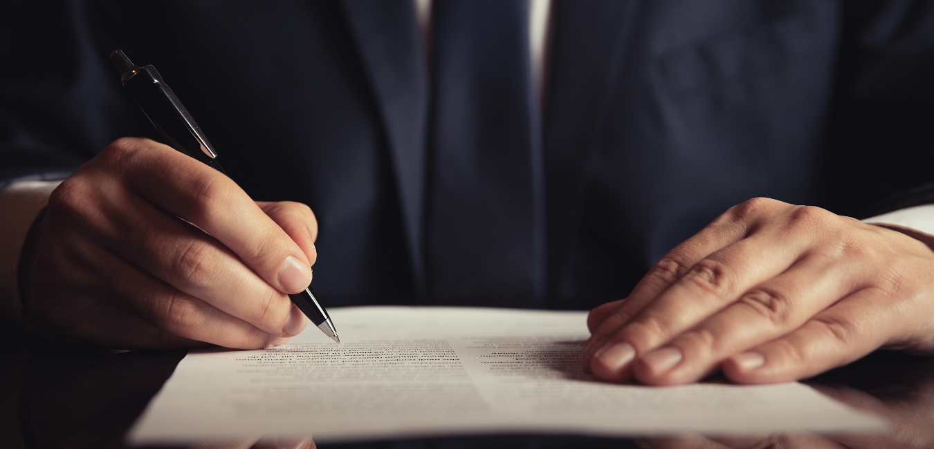 Man writing down on legal document